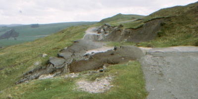 The Old A625 as it passes beneath Mam Tor